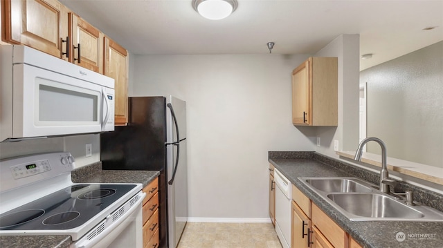 kitchen with light brown cabinets, sink, white appliances, and light tile patterned floors