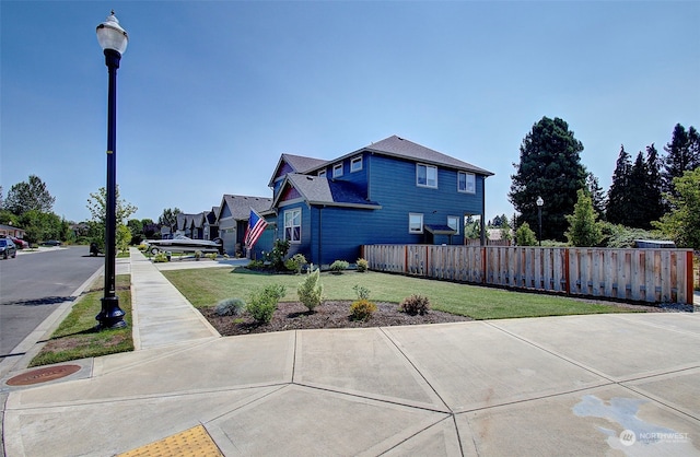 view of home's exterior with a lawn