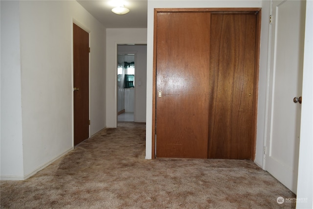 hallway with carpet