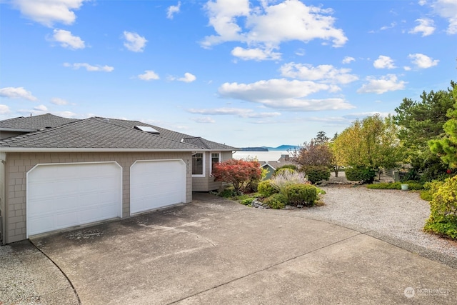 view of side of home featuring a garage