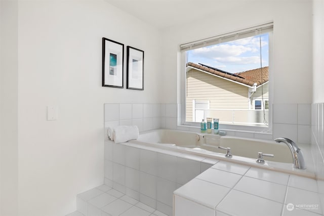 bathroom with tiled tub