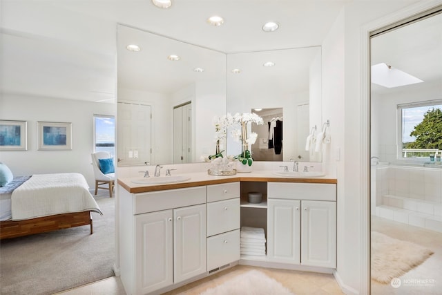 bathroom with vanity and walk in shower