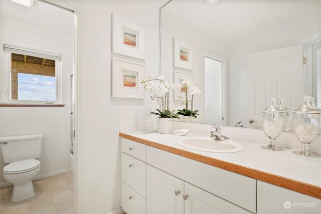 full bathroom featuring vanity, shower / washtub combination, and toilet