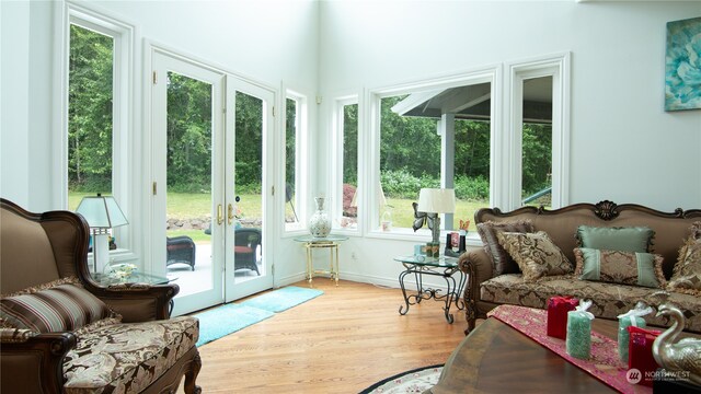 sunroom / solarium with french doors and a healthy amount of sunlight