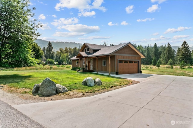 view of front of house with a garage and a front lawn