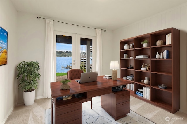 home office featuring baseboards, french doors, a water view, and light colored carpet