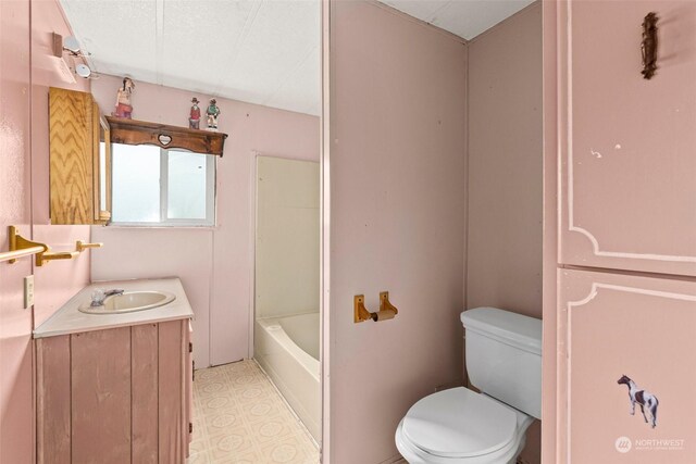 full bathroom featuring shower / bathtub combination, a textured ceiling, tile patterned floors, toilet, and vanity