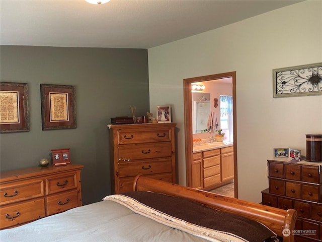 bedroom with ensuite bath and sink