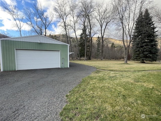 garage featuring a yard