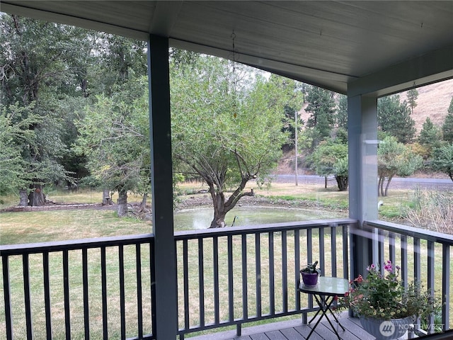 deck featuring a lawn