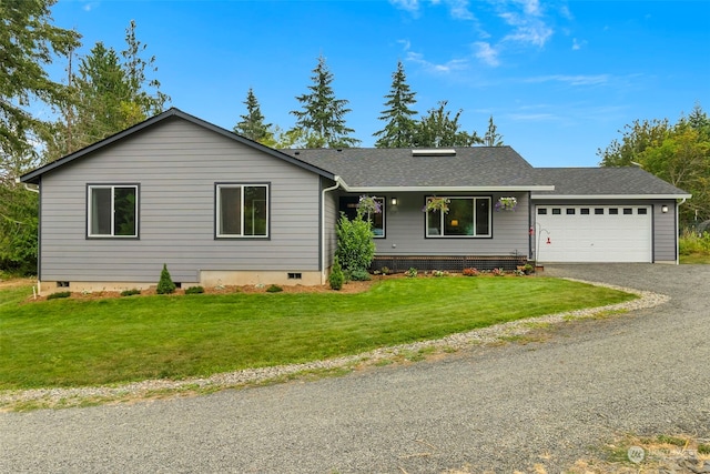 ranch-style home with a garage and a front lawn