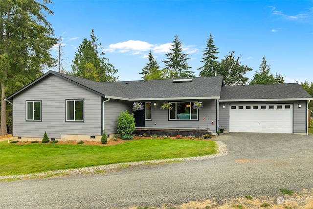 single story home with a garage and a front lawn