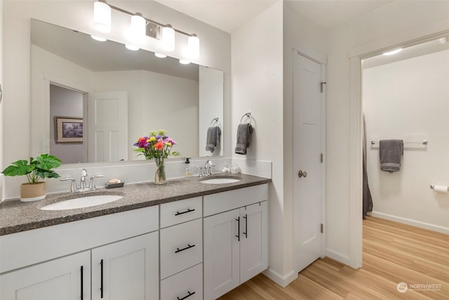 bathroom featuring vanity and hardwood / wood-style flooring