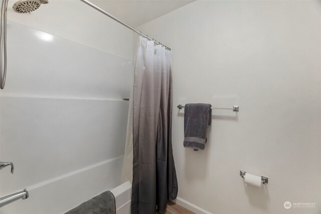 bathroom with shower / bath combo