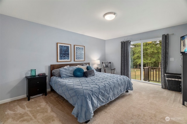 carpeted bedroom featuring access to outside