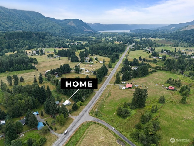 drone / aerial view featuring a mountain view and a rural view