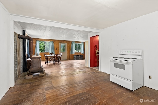 kitchen featuring electric stove, dark hardwood / wood-style floors, and a textured ceiling