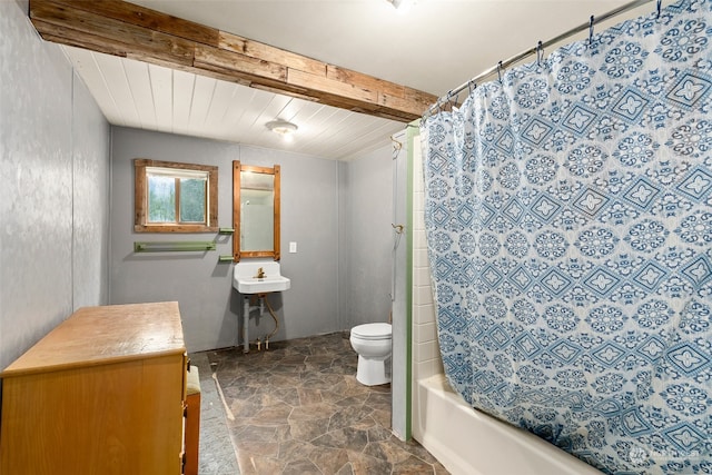 full bathroom with vanity, beam ceiling, shower / bath combo, toilet, and tile patterned flooring