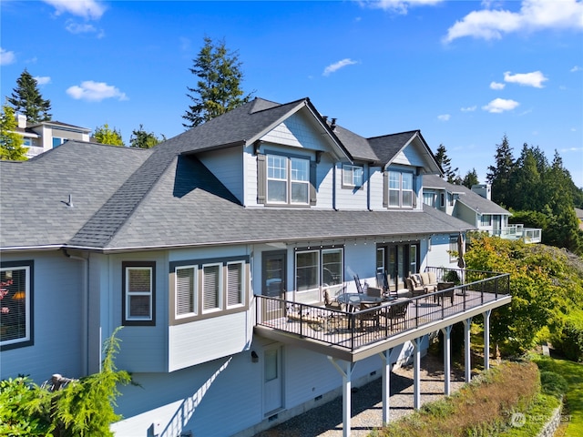 back of house with a wooden deck