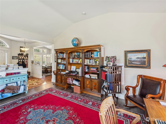 office with vaulted ceiling and hardwood / wood-style floors