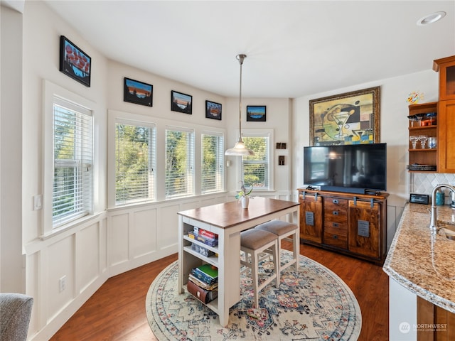 dining area with dark hardwood / wood-style floors