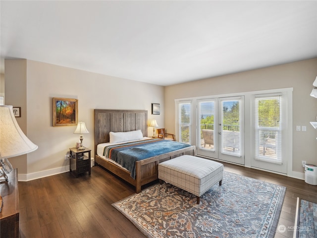 bedroom featuring access to outside and dark hardwood / wood-style flooring