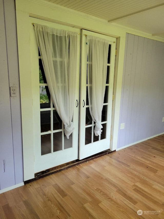 interior space featuring hardwood / wood-style flooring and ornamental molding