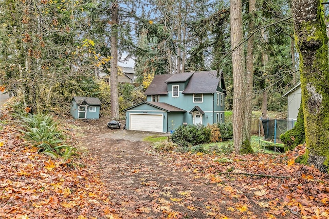 view of front of property with a storage shed and a trampoline