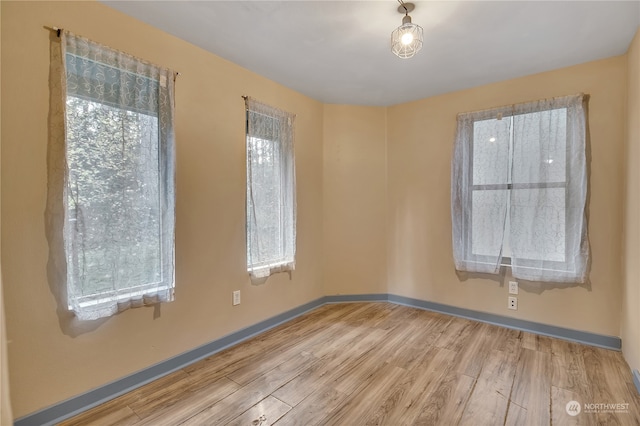 unfurnished room featuring light hardwood / wood-style flooring