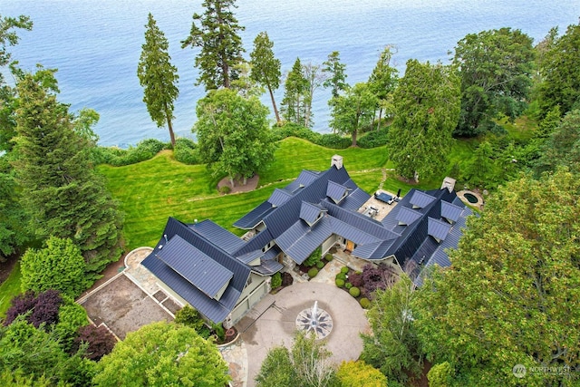 birds eye view of property with a water view