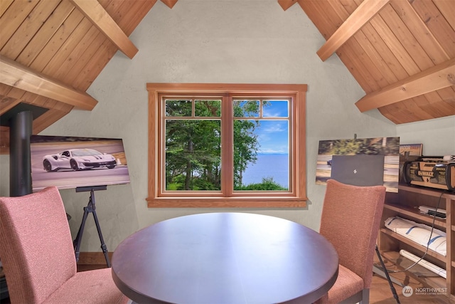 dining room featuring high vaulted ceiling, beam ceiling, and wooden ceiling