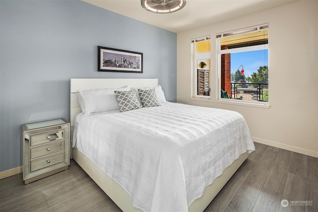 bedroom with hardwood / wood-style floors