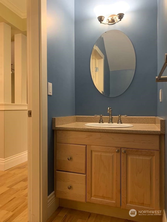 bathroom with wood-type flooring and vanity