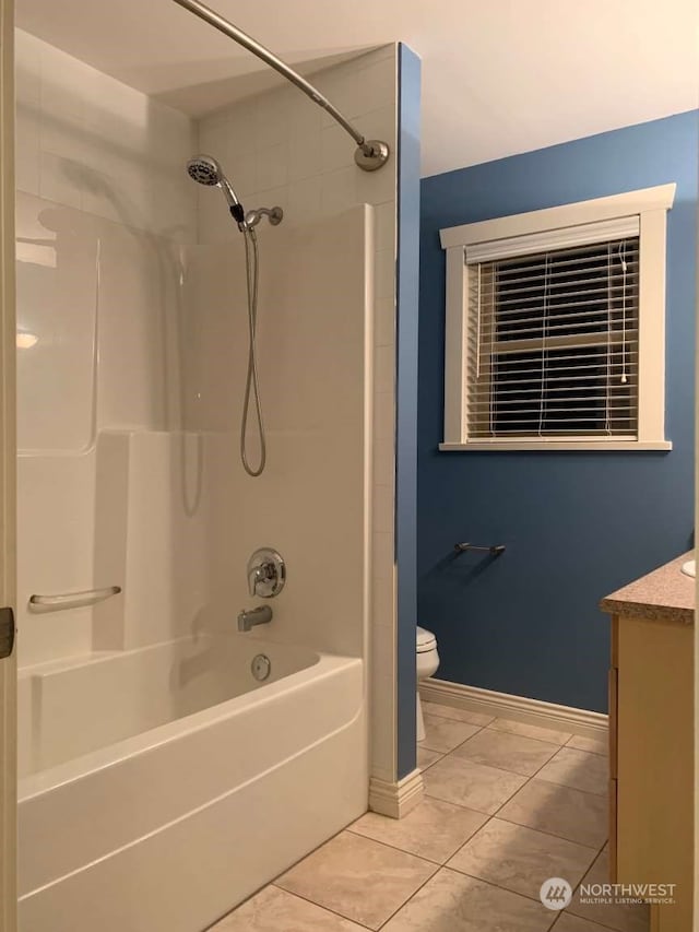 full bathroom featuring vanity, bathtub / shower combination, toilet, and tile patterned flooring