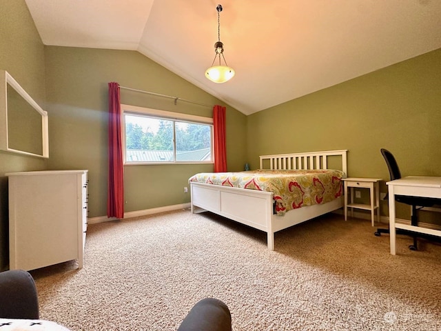 carpeted bedroom featuring lofted ceiling