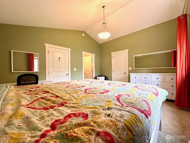 carpeted bedroom featuring vaulted ceiling