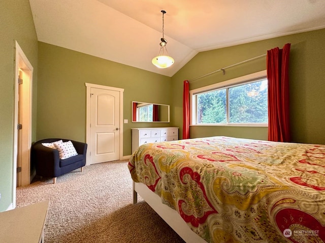 carpeted bedroom with vaulted ceiling