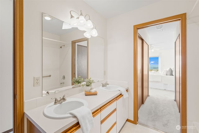 bathroom with shower / tub combination and vanity