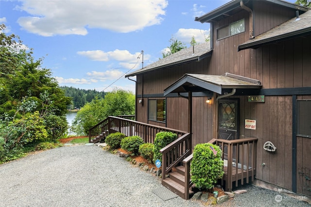 view of property exterior with a deck