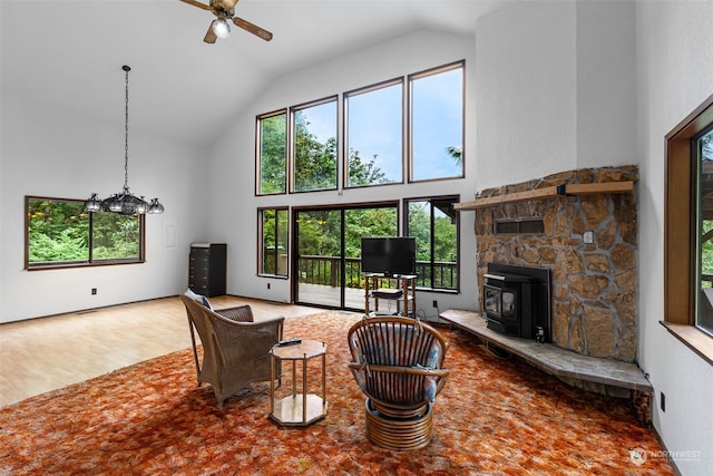 living room featuring ceiling fan and high vaulted ceiling