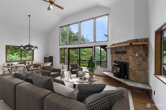 living room featuring wood-type flooring, ceiling fan, and high vaulted ceiling