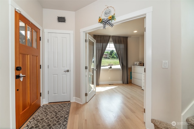 foyer with light hardwood / wood-style flooring