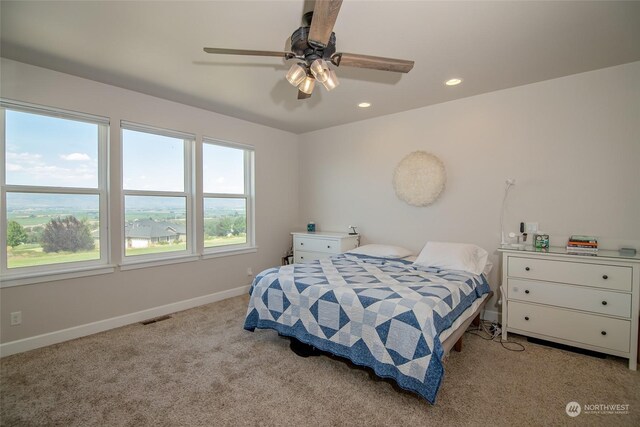 carpeted bedroom with ceiling fan