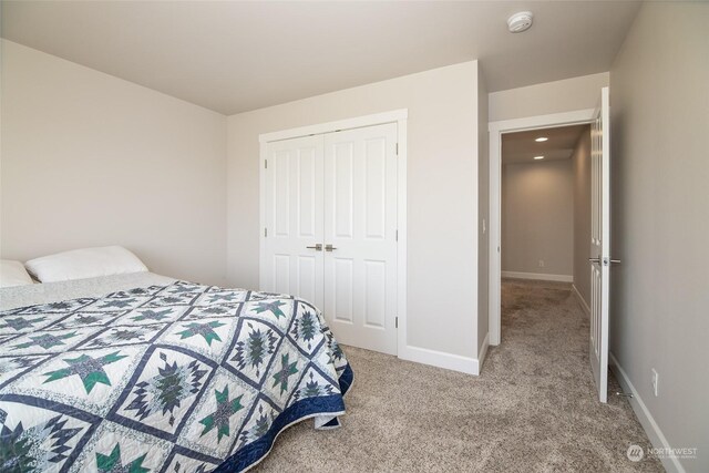 carpeted bedroom with a closet