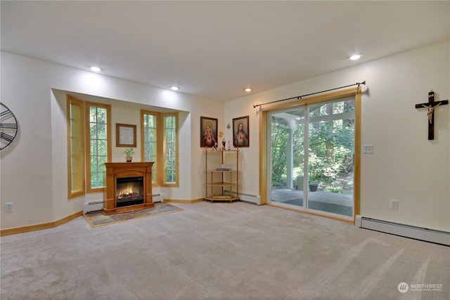 unfurnished living room with a baseboard radiator and light colored carpet