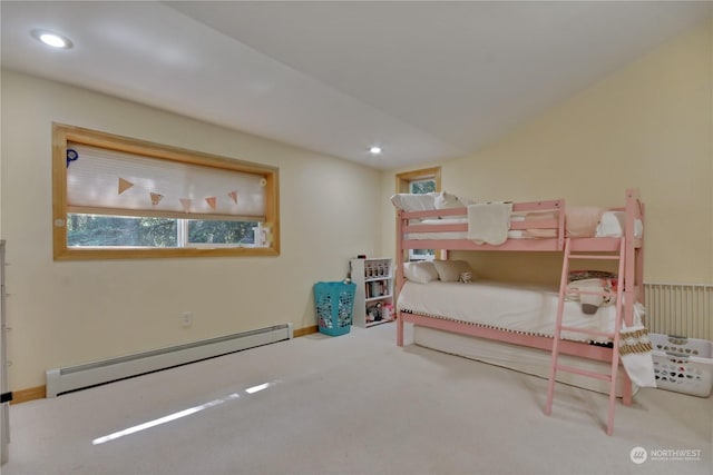 carpeted bedroom featuring baseboard heating