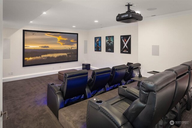 carpeted home theater with ornamental molding