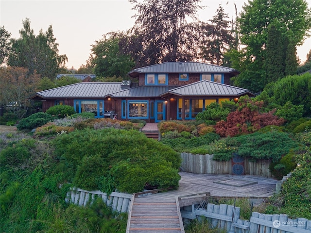 back of property featuring a wooden deck