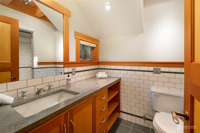 bathroom featuring tile walls, tile patterned flooring, vanity, and toilet