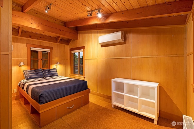 470 Friday Ave, Friday Harbor, WA 98250 - bedroom featuring rail lighting, an AC wall unit, wooden ceiling, and wood walls